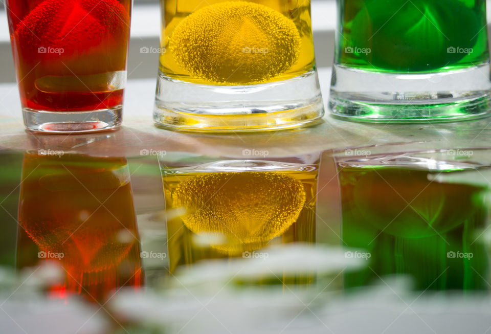 Easter eggs in glasses with paint . Preparation for Easter