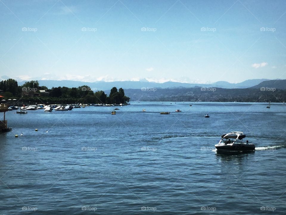 This is a picture of Lake Zurich in Switzerland. In the background you can see the Alps.