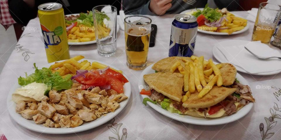 Dinner in Crete with Shwarma, Sandwiches. and a Beer
