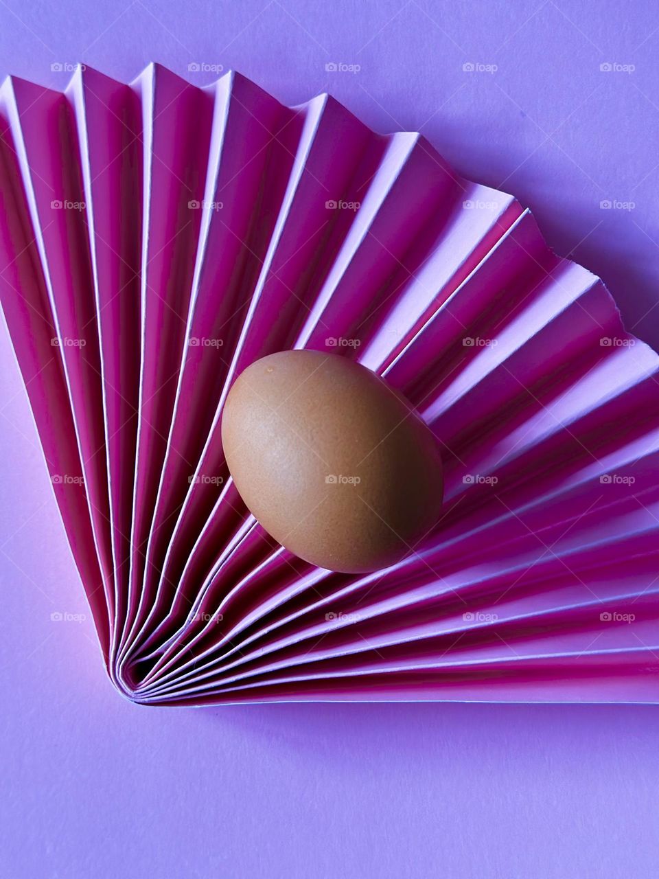 Egg on paper fan.