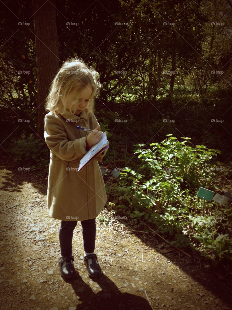 Making notes at RHS Gardens, Wisley. RHS Wisley, Surrey, England