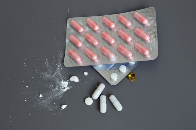 Multicolored pills lie on the table