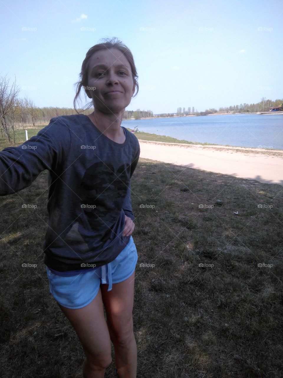 girl selfie on a lake spring time