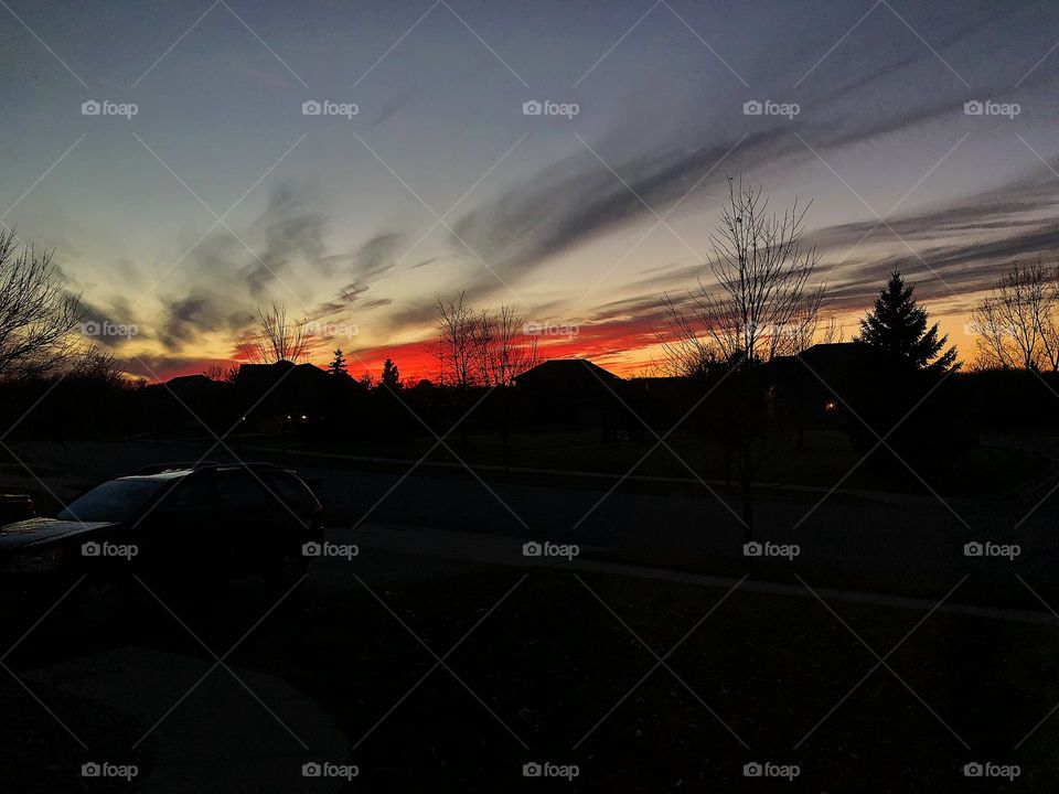 Colorful picture of a neighborhood at sundown