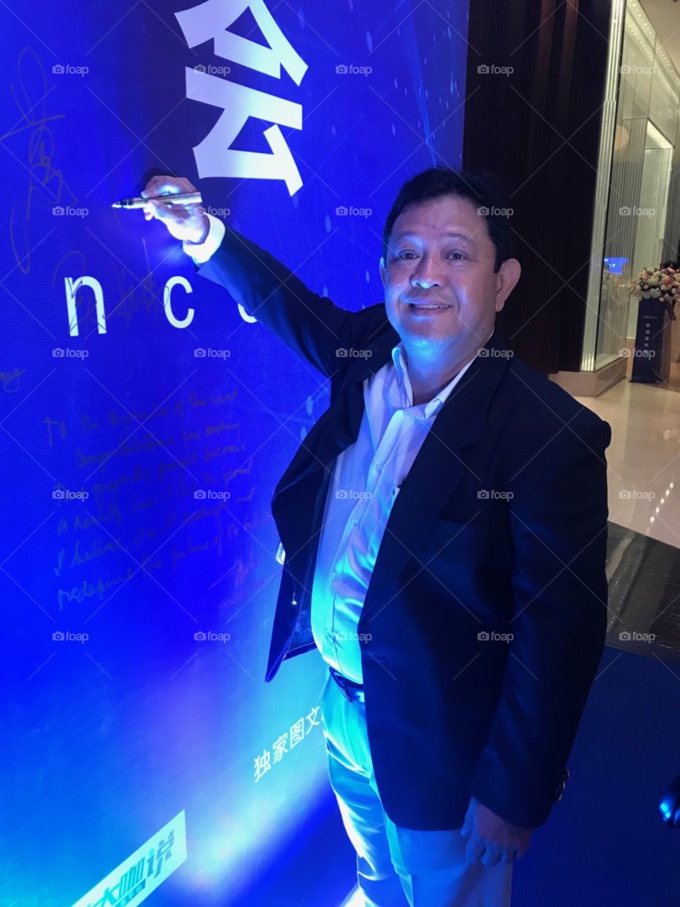 seminar participant writing on the board