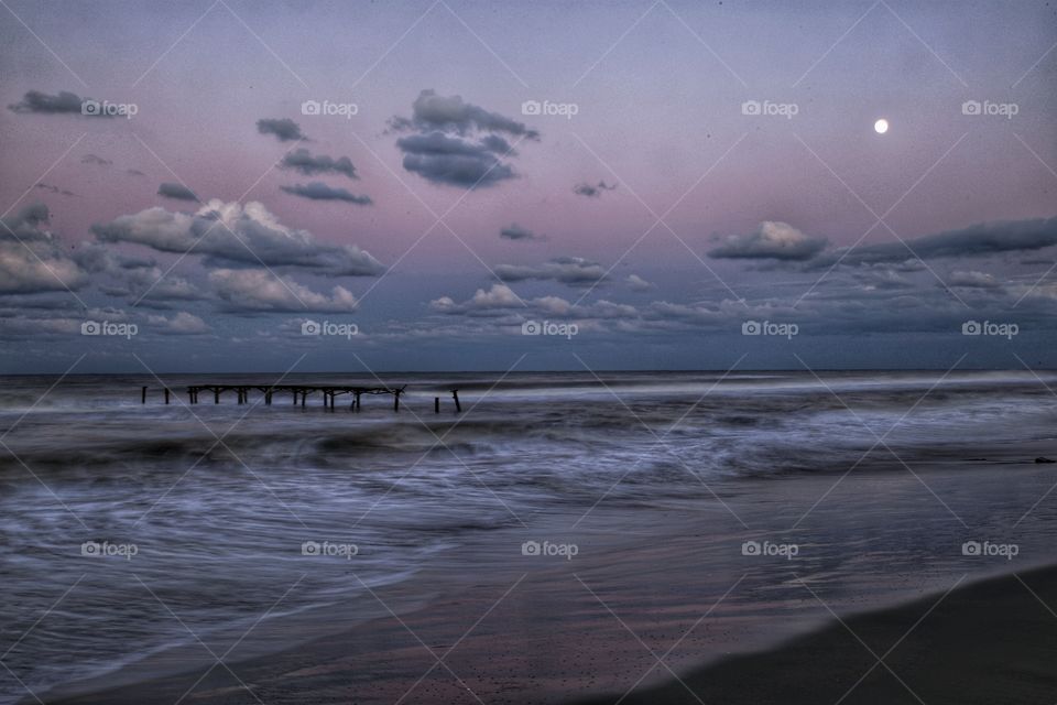 Broken jetty in wavy Black Sea