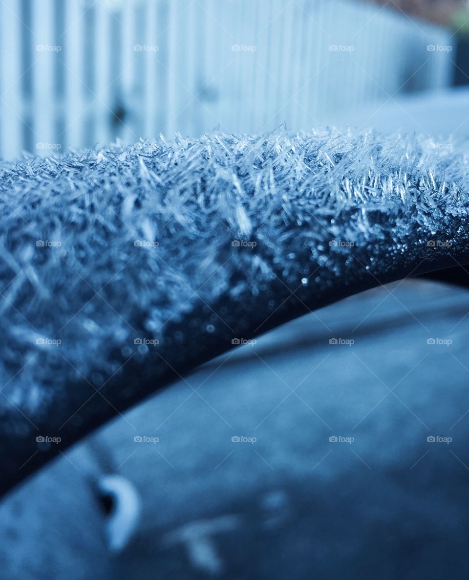 Frost on car's wing mirror