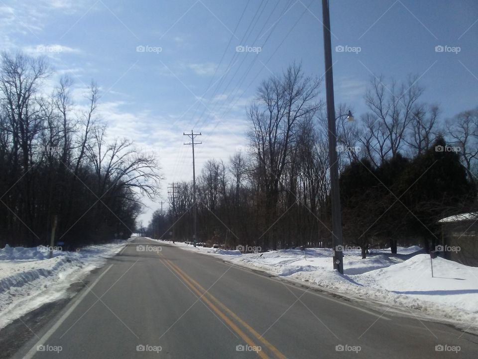 County Highway P. running South on the Westside of Elkhart Lake on an early March afternoon.