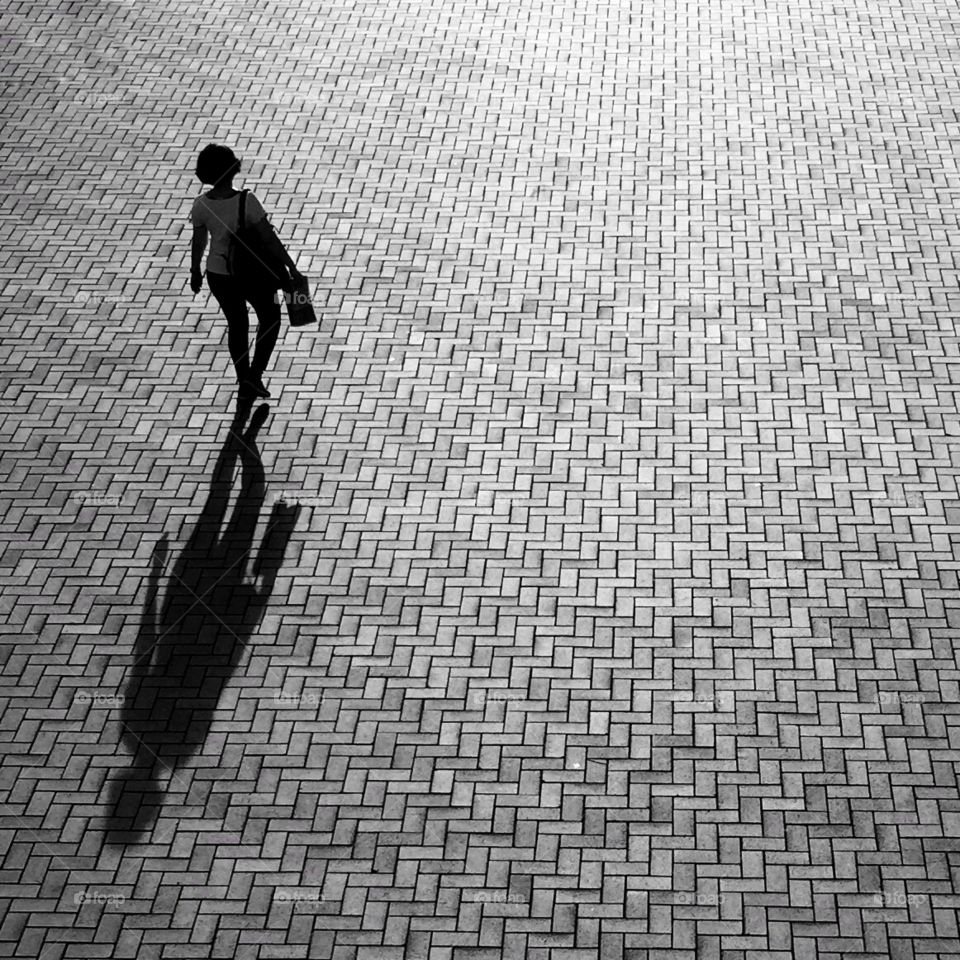 Woman walking in the early morning sun