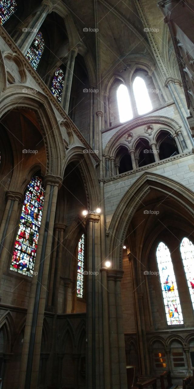 looking up at cathedral arches and windows