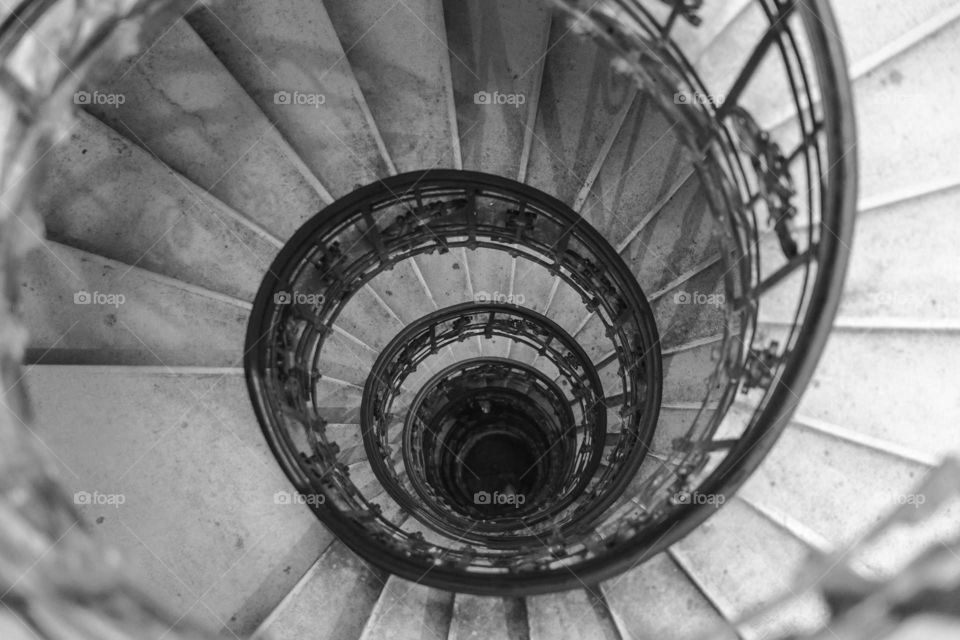 A stairway having a closed circular form consisting of uniform section shaped treads attached to and radiating from a minimum diameter supporting column