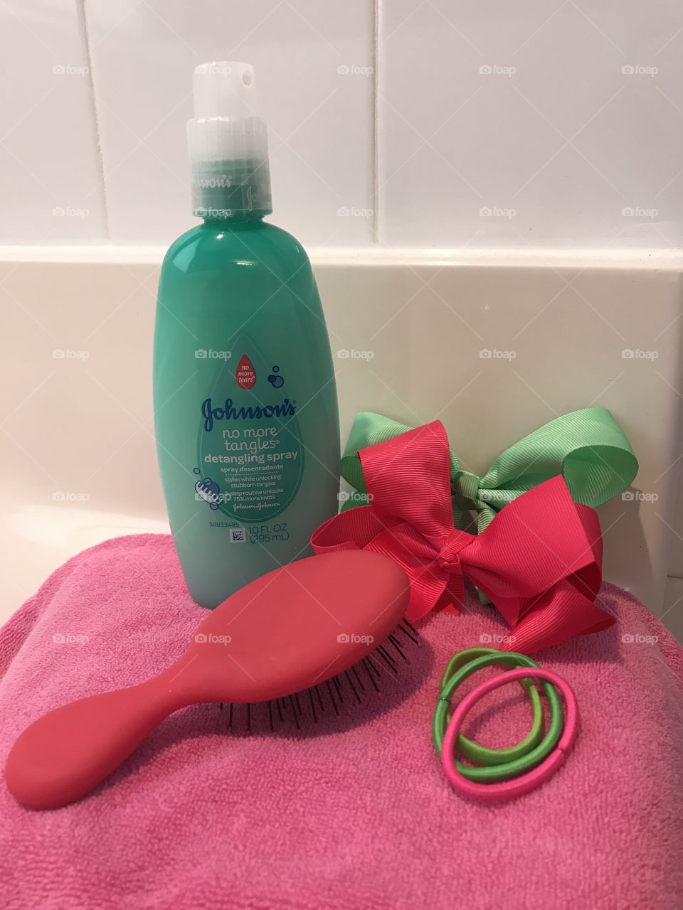 Johnson and Johnson no more tears hair product with ribbons and a hairbrush. 