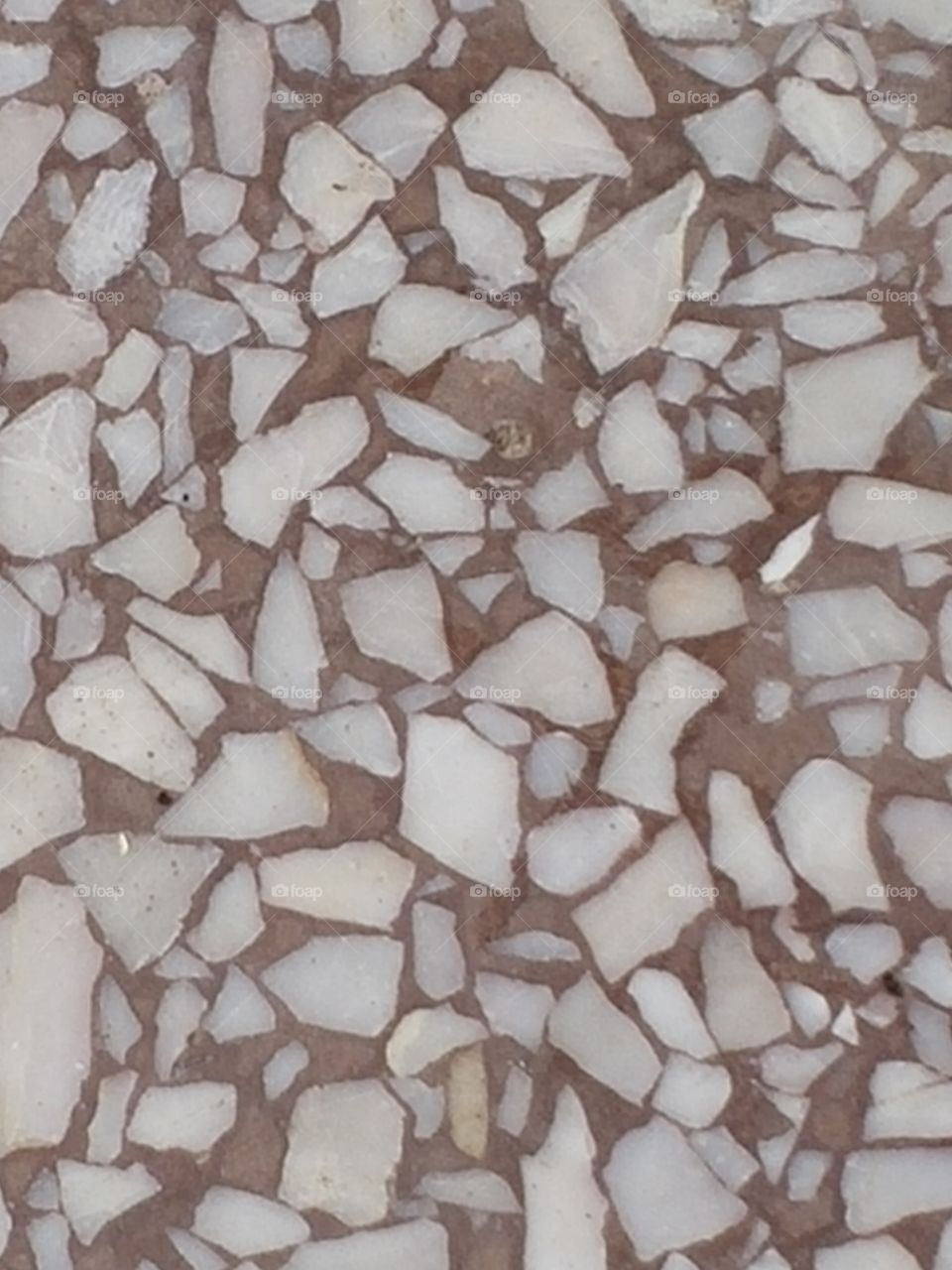 Balcony floor surface made by pieces of marble.