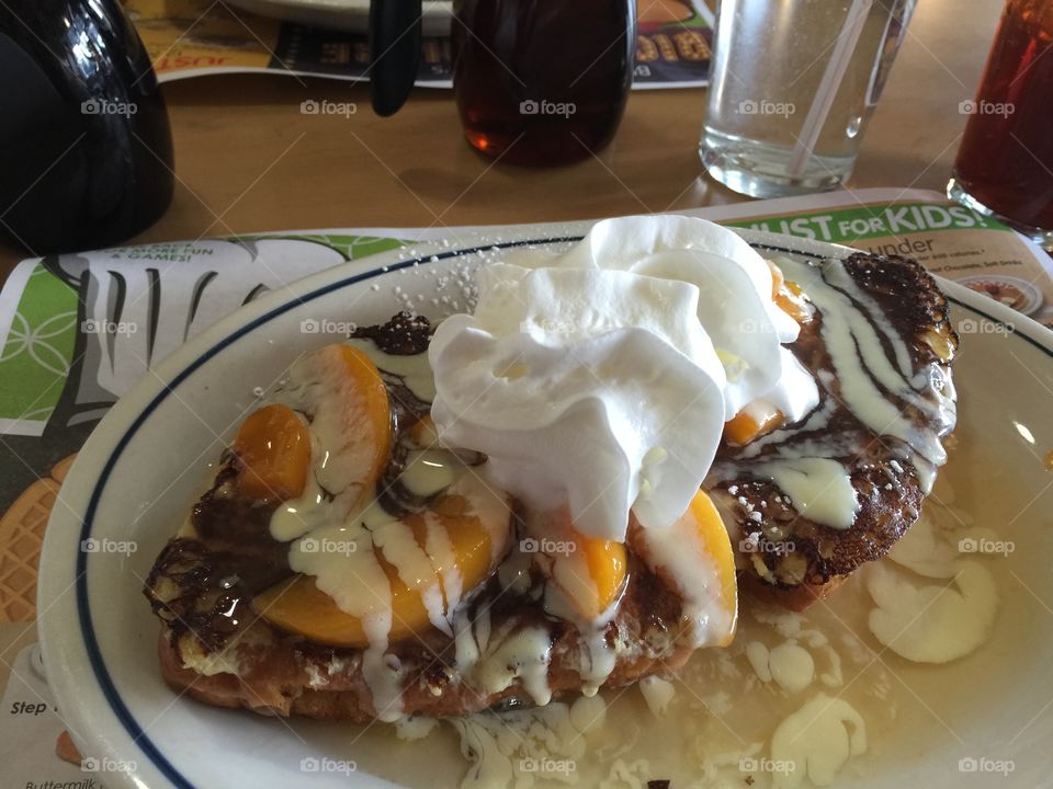 Delicious Dessert. A delicious peach French toast meal in Queens, NY diner.