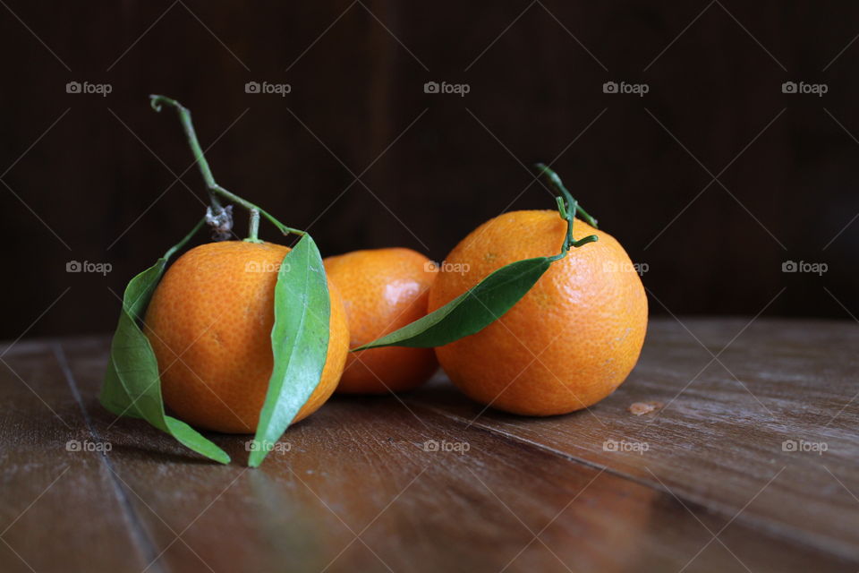 oranges Mandarin on wooden table