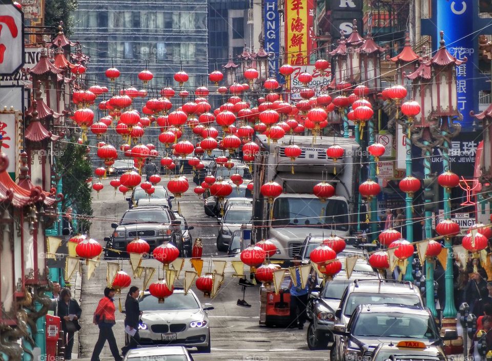 Red Chinese Lanterns Hang Over Busy Street. Chinese New Year Decorations
