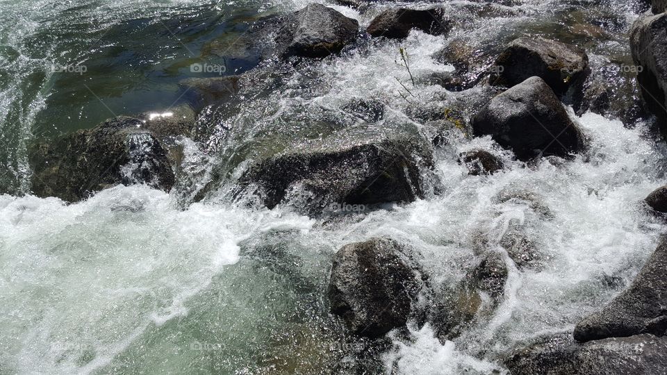 water swirling around rocks