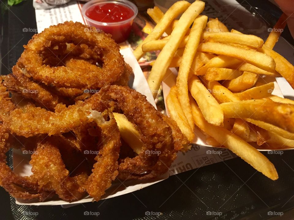 onion rings and fries with ketchup 