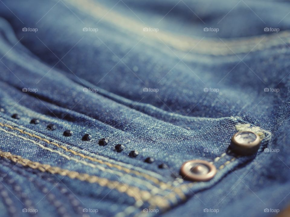 Closeup detail of blue denim jeans