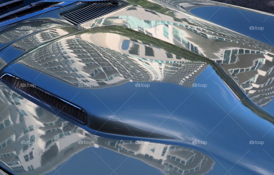 Architecture abstract reflection on vintage corvette sting ray muscle car hood