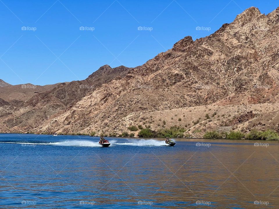Jet skis driving up the canyon at Lake Mohave 