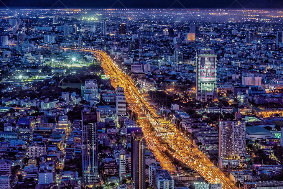 Beautiful night scene of vehicle light on express way in Bangkok city Thailand