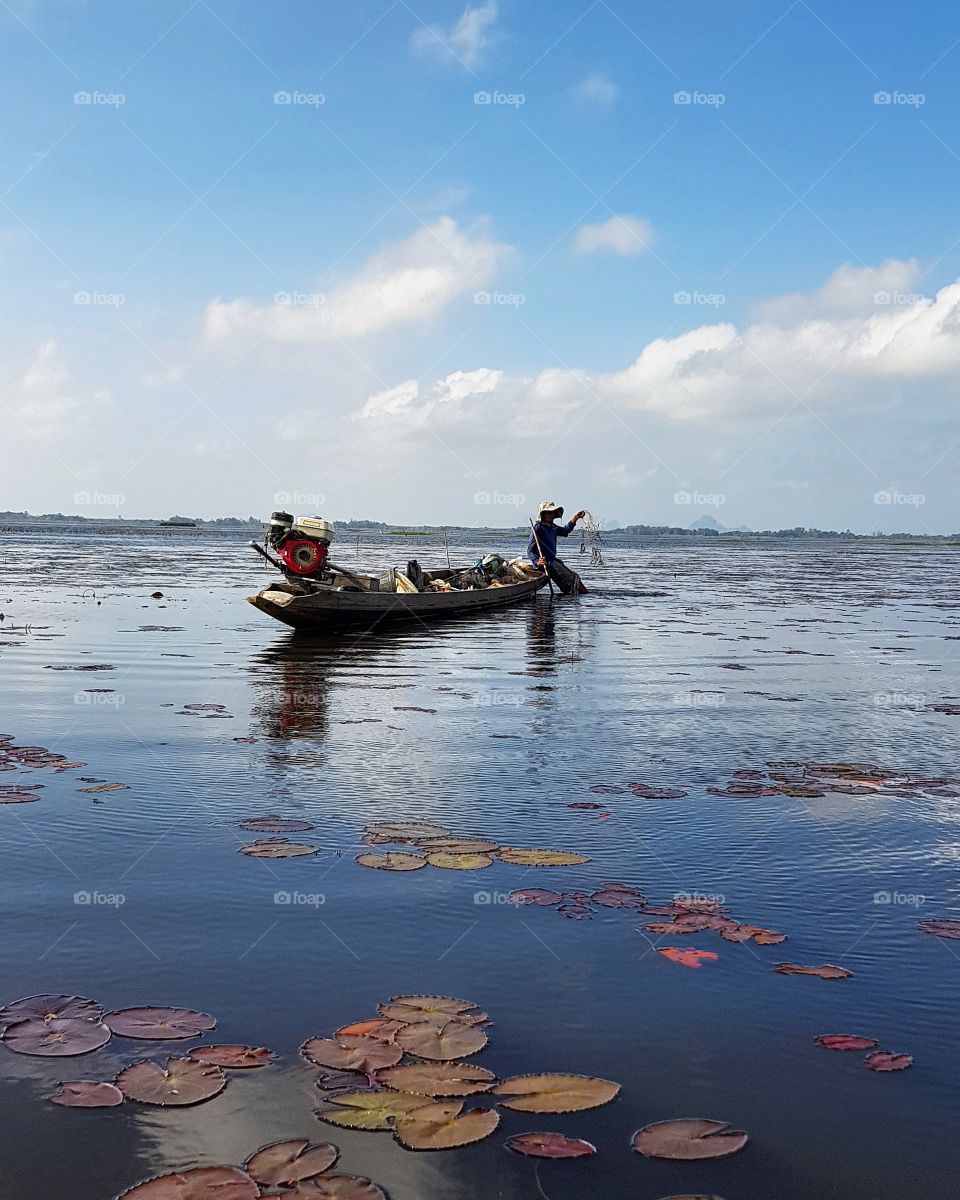 scenic view of lake against blue sky