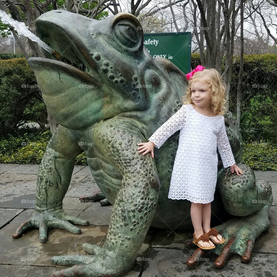 a girl and her frog