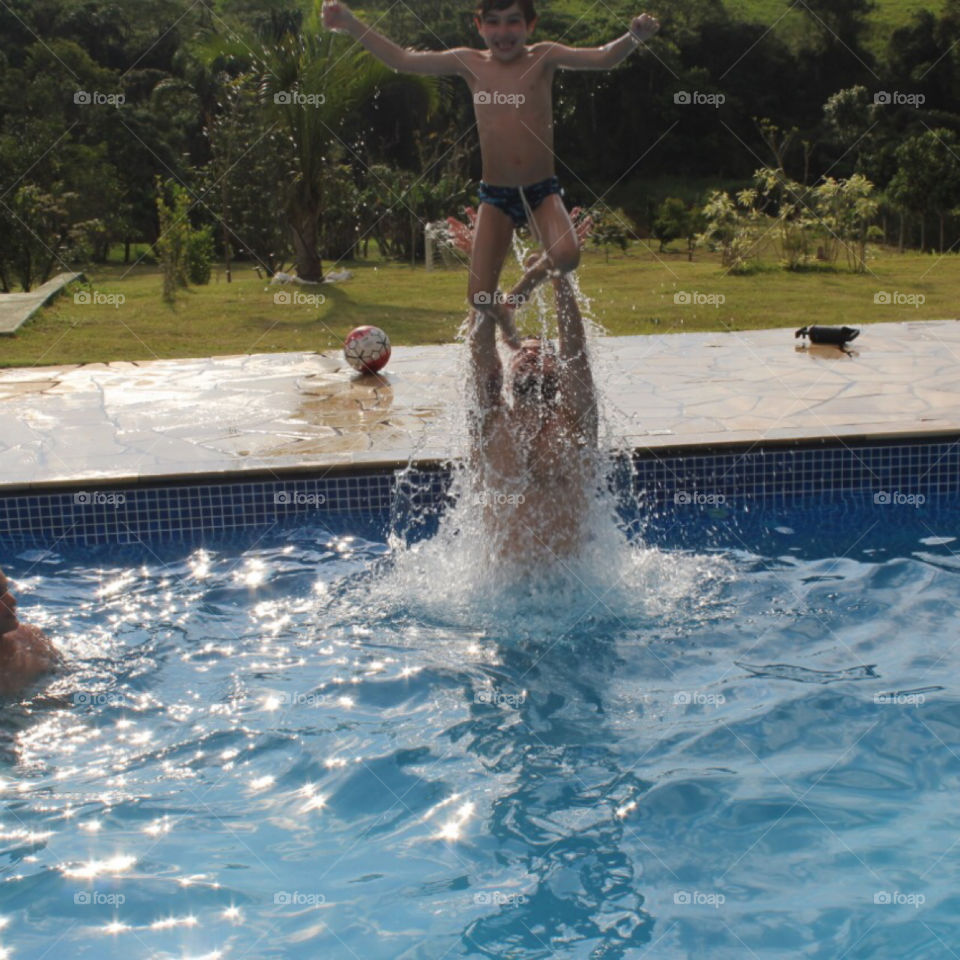 Brazilian babies playing outside the pool