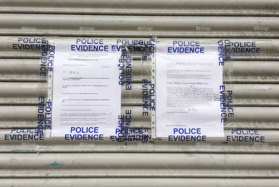 Legal Notice from Police in London at a closed store at Camden Market.