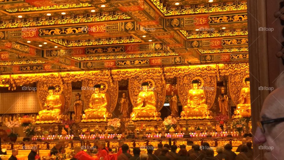 The Monks praying, meditating and chanting in the Room of the 5 Thousand Buddhas. The Po Lin Monastery. Ngong Ping Village, Po Lin Monastery, Lantau Island, Hong Kong.