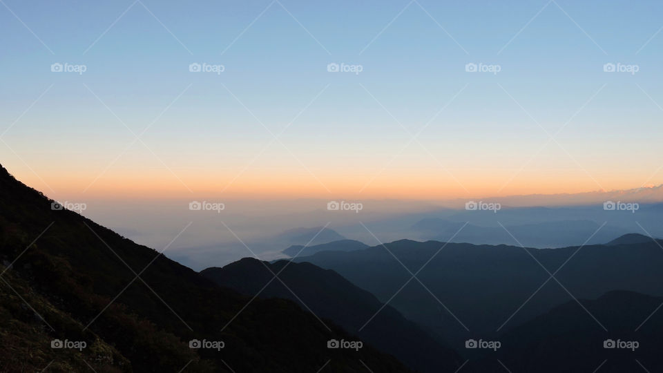 Scenic view of mountains at sunrise