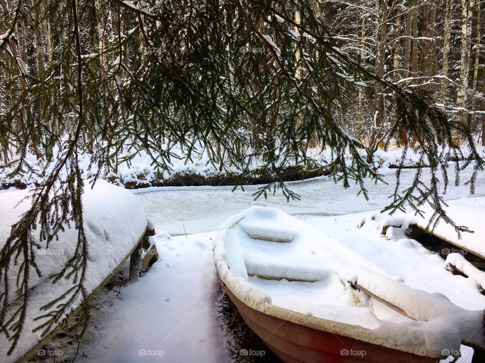 Snowy boats in nuuksio national park 
