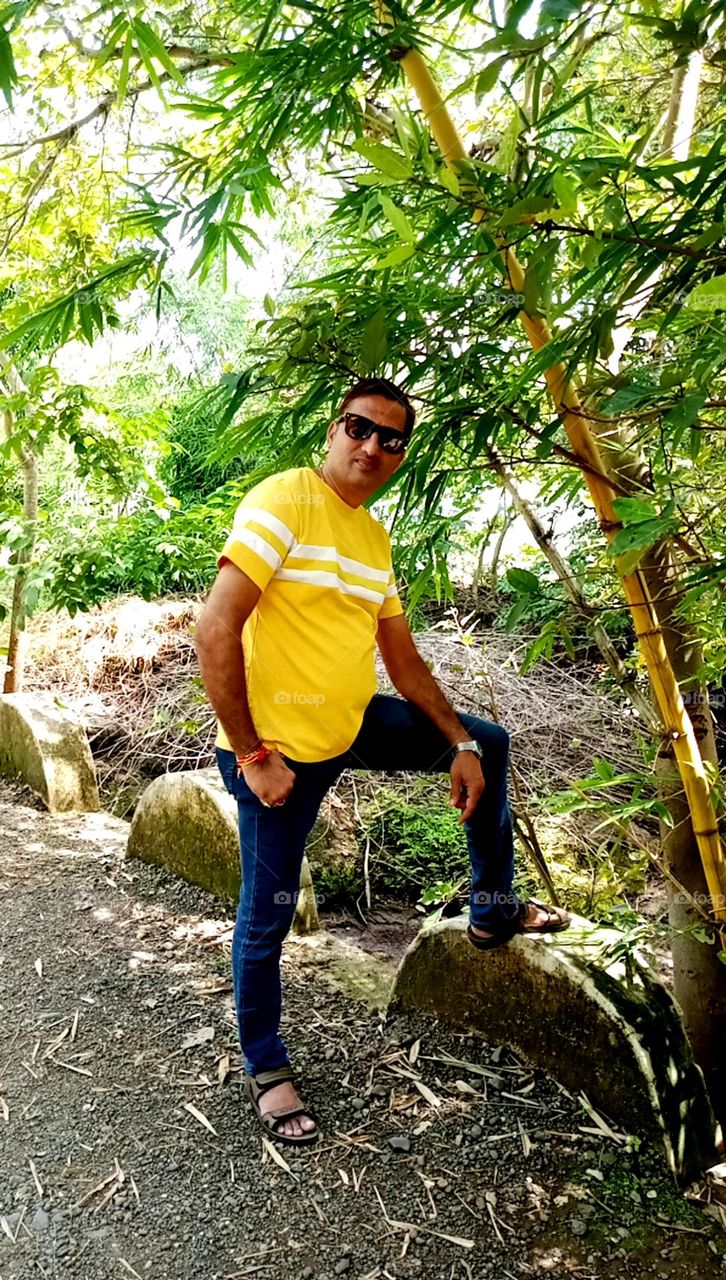 what a stttunning looks men standing on forest place nice nature place so beautiful atmosphere and men looks so nice Indian men