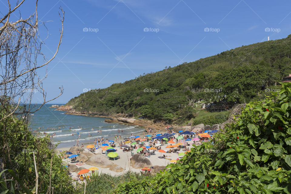 Tourists enjoy the summer on the little beach in Barra da Lagoa in Florianopolis Santa Catarina Brazil.