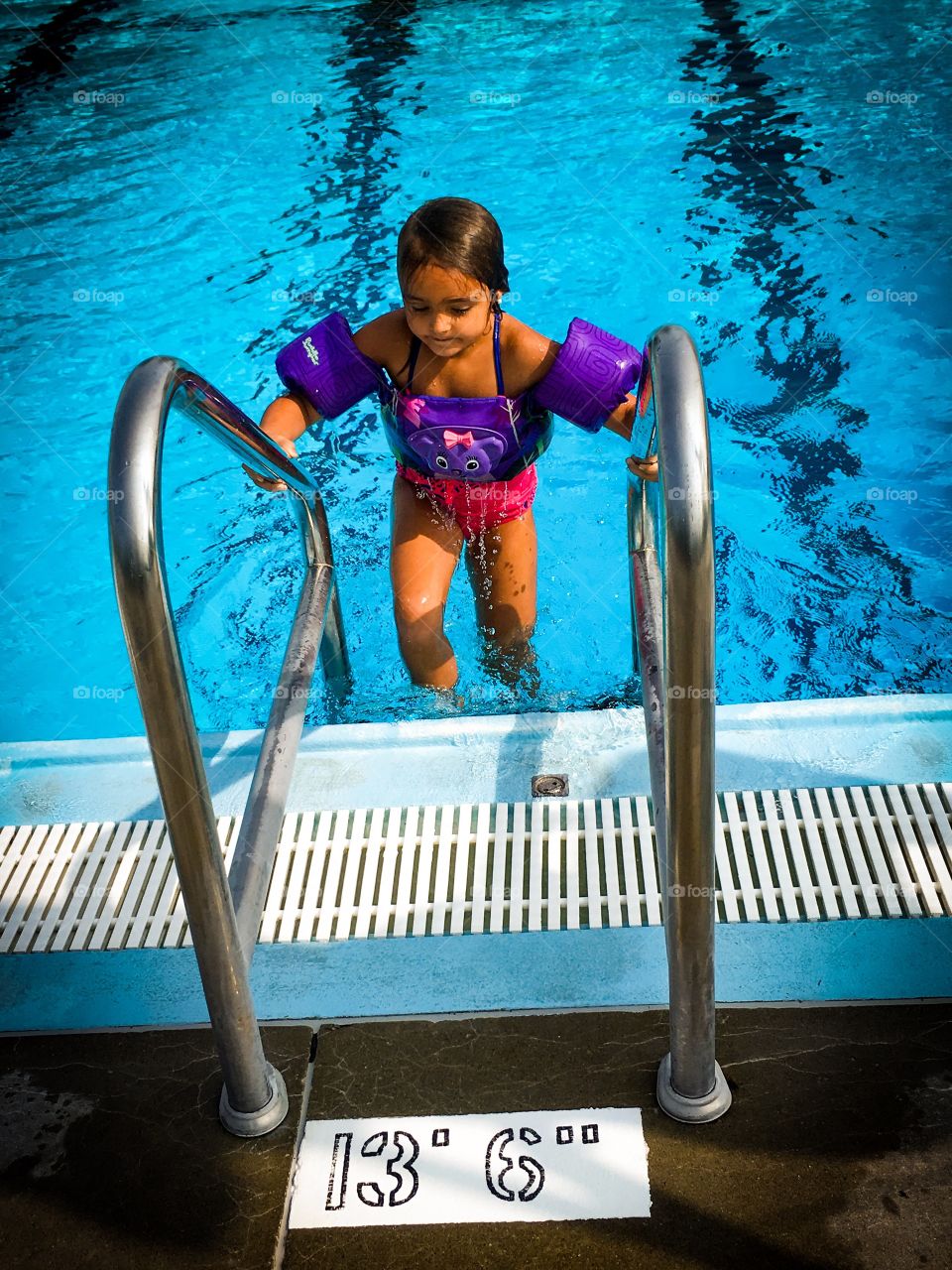 My daughter at the city pool.