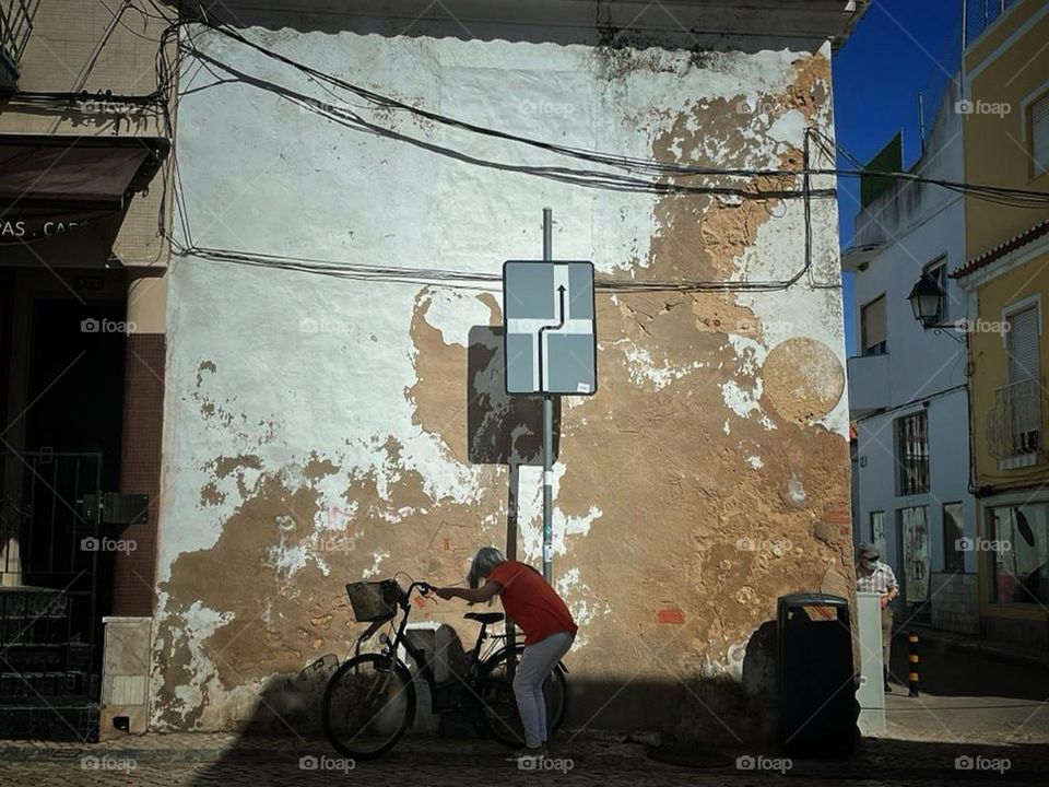 Old women traveling in her bike.
Lisbon, Portugal.