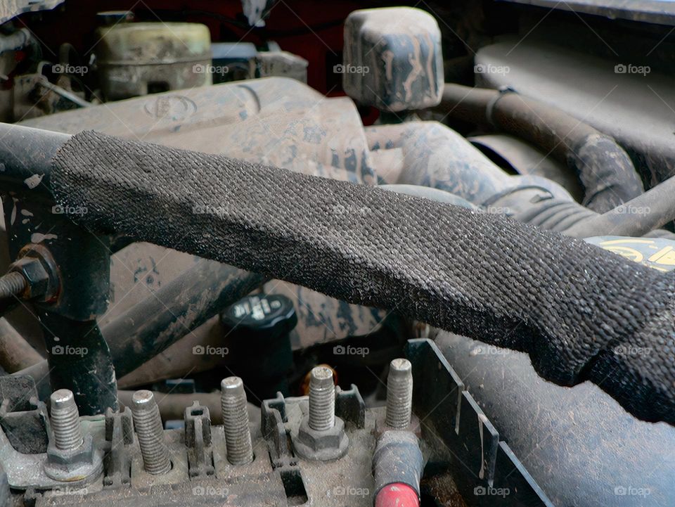 Under the hood of a red pickup truck overview.