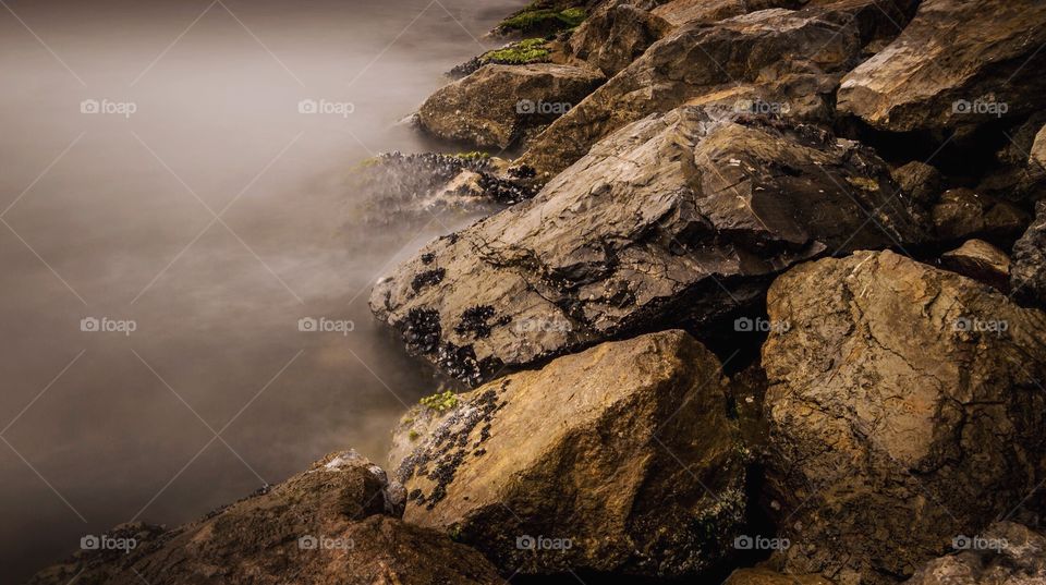 Long exposure, misty rocks