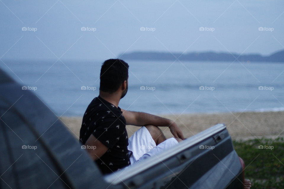 man sitting in his truck