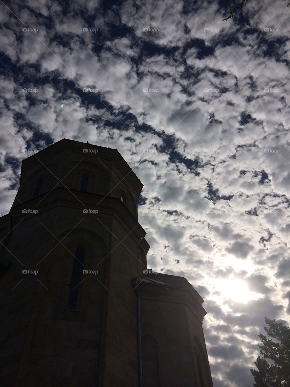Clouds, sky, the sun and church