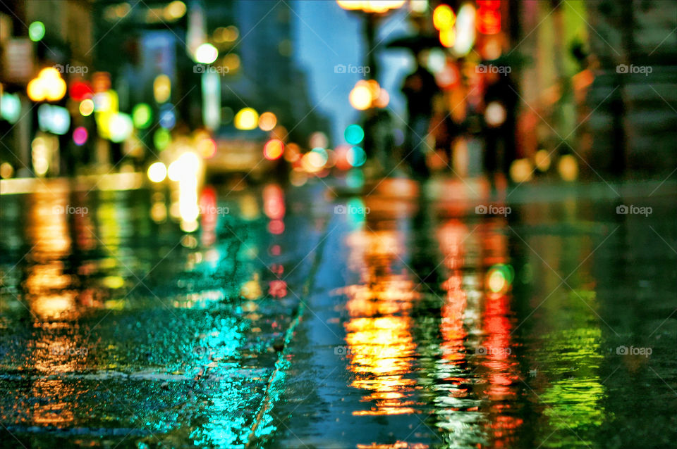 Reflection of city lights on wet street