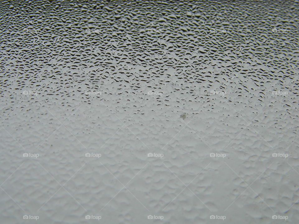 Water drops on window glass after rain