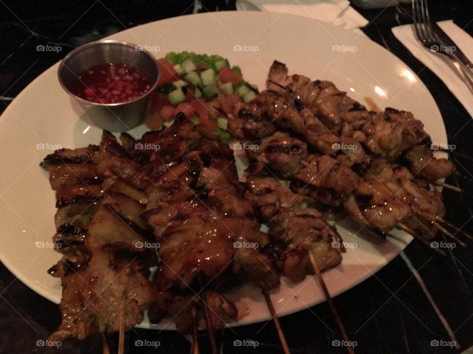 Grilled pork and chicken skewers