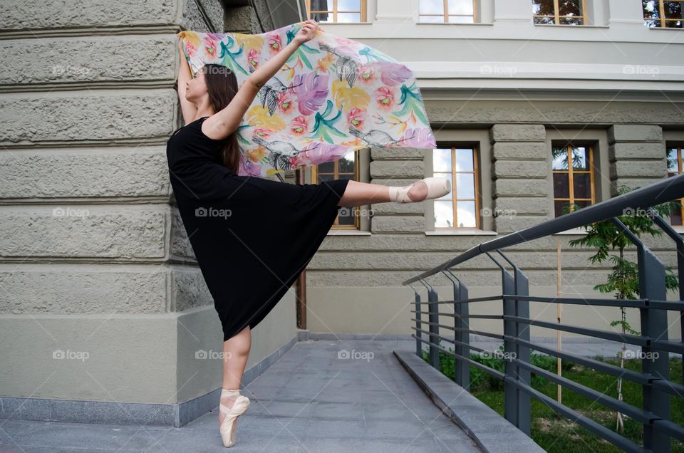 Young Female Ballerina Dancing Outside with Scarf