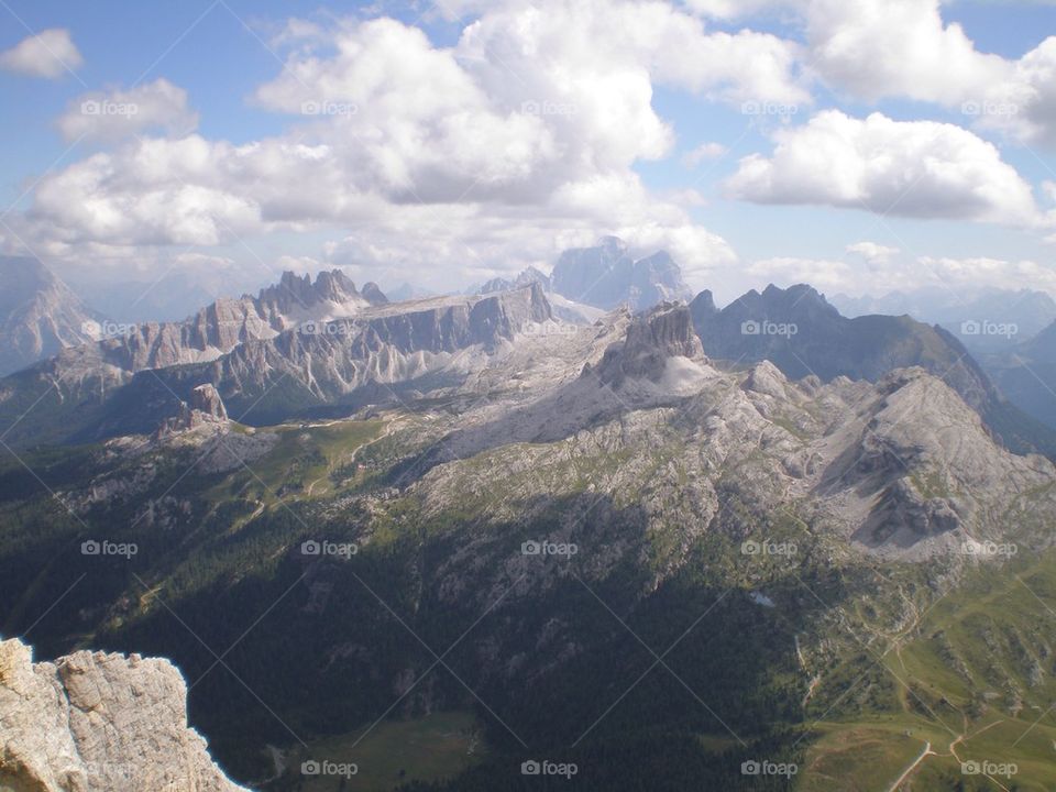 Scenic view of rocky mountains against cloudy sky