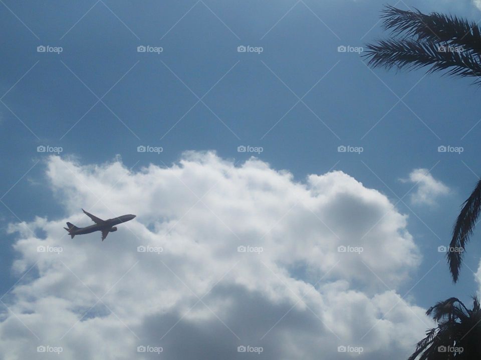 Beautiful airplane flying across the foggy sky. at marrakech city in Morocco.