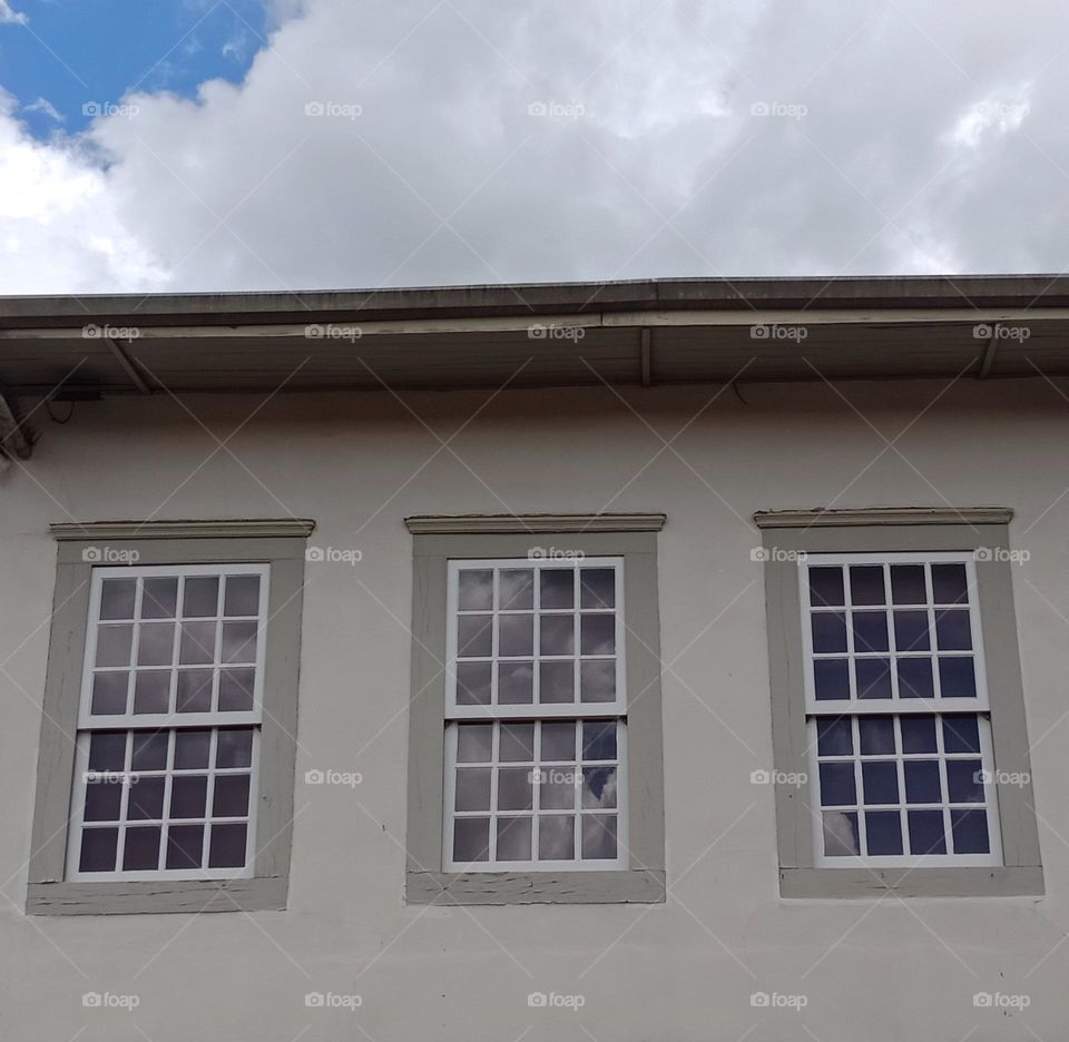 windows of a historic old house on a sunny day