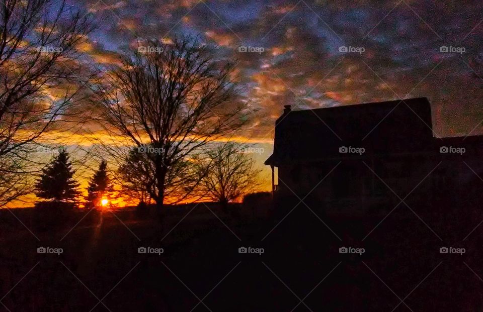 barn silhouette with sunset
