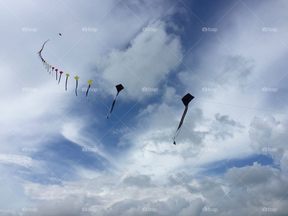 Kites flying on an empty sky in Singapore marina barrage